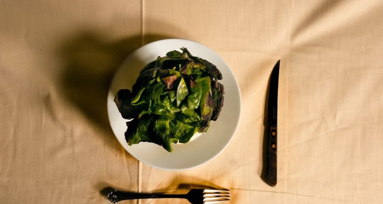 green vegetable on white ceramic bowl